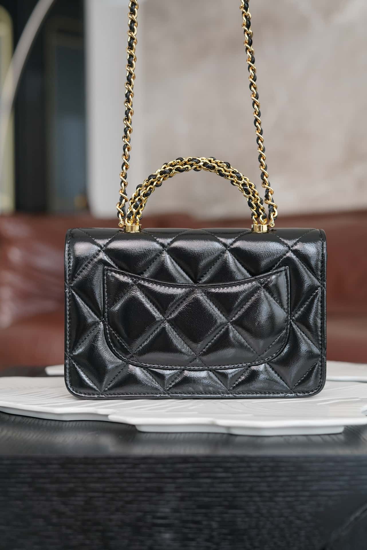luxury 24B WOC Top Handle in Black Shiny Lambskin GHW