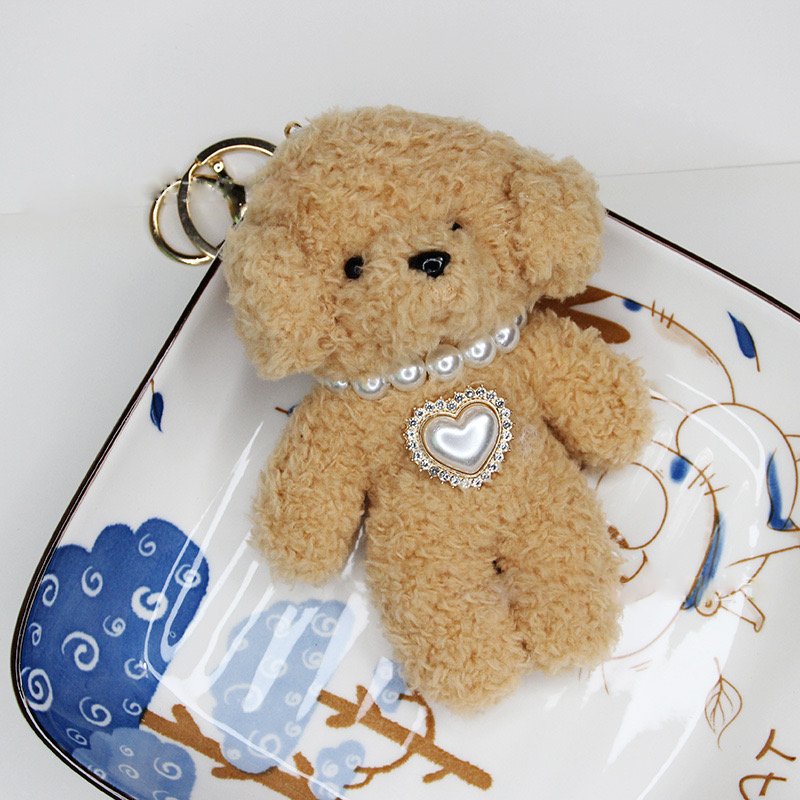 Adorable encanto de bolsas de peluche de caniche