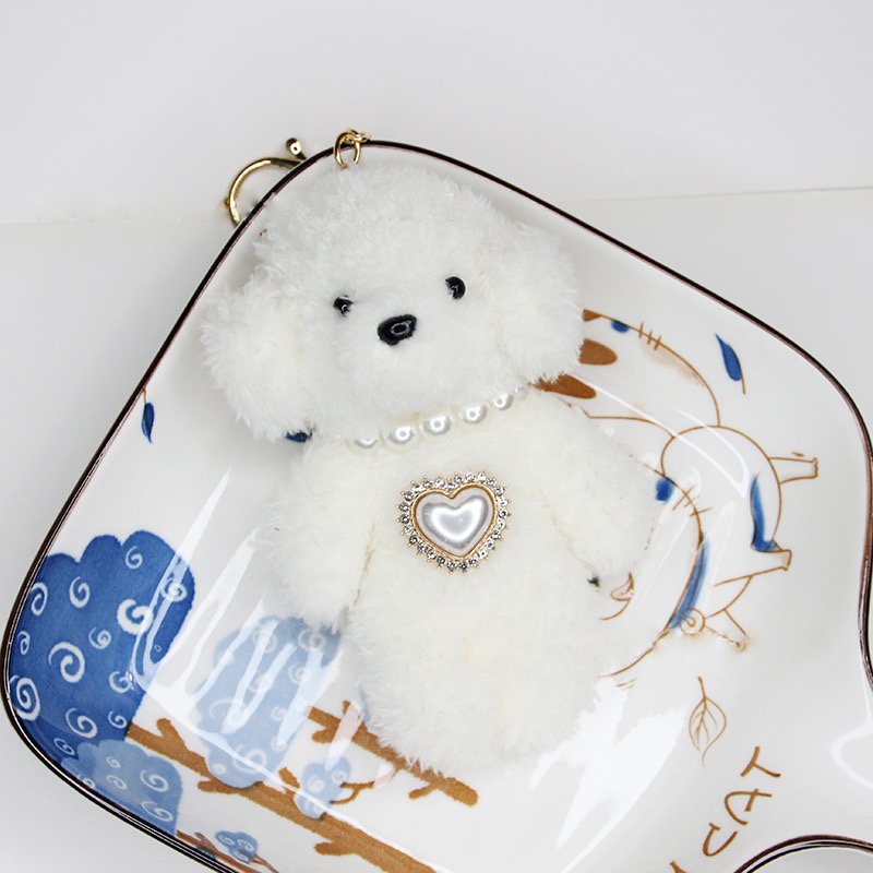 Adorable encanto de bolsas de peluche de caniche