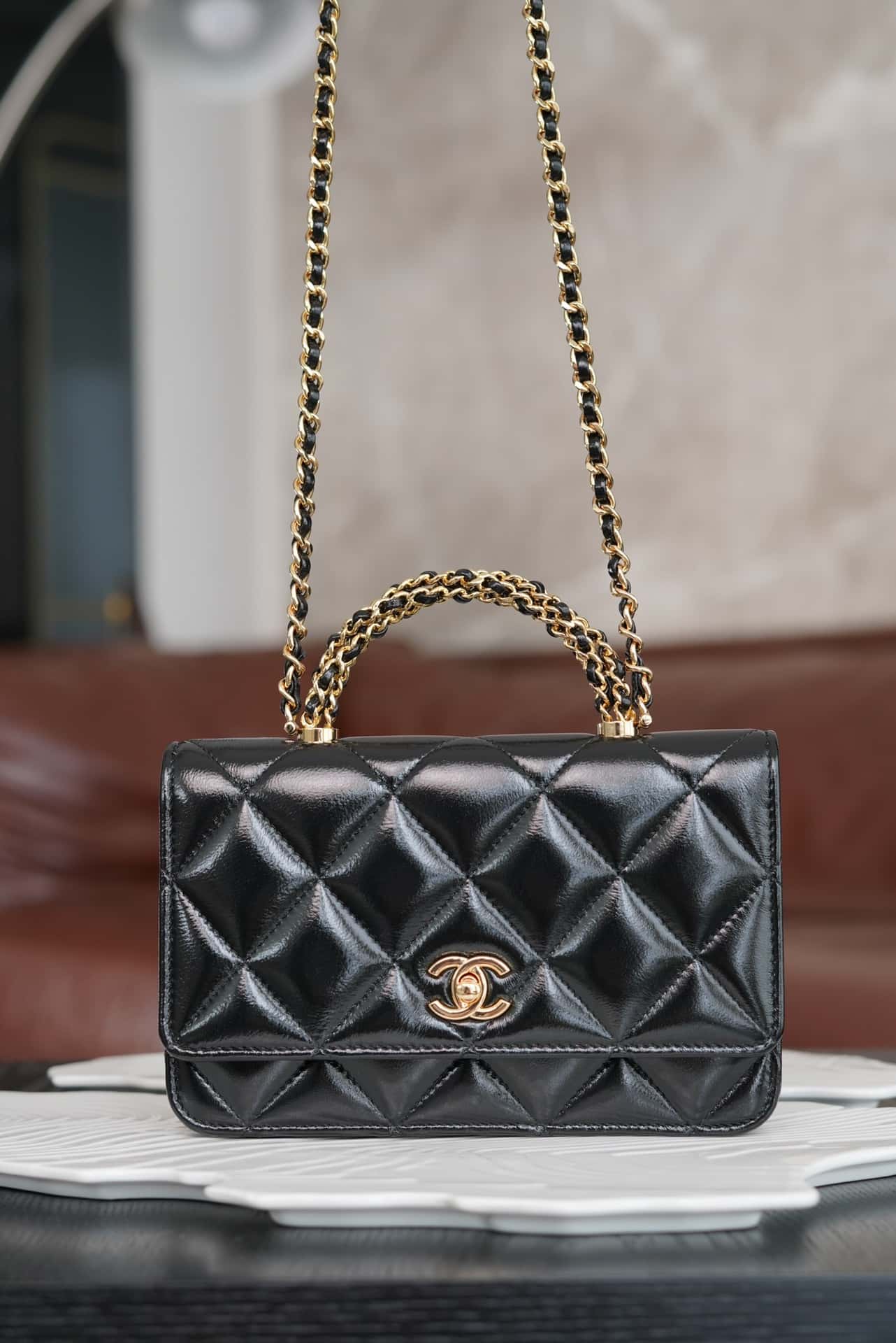 luxury 24B WOC Top Handle in Black Shiny Lambskin GHW